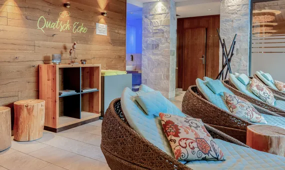 Modern wellness lounge with woven loungers and ambient lighting