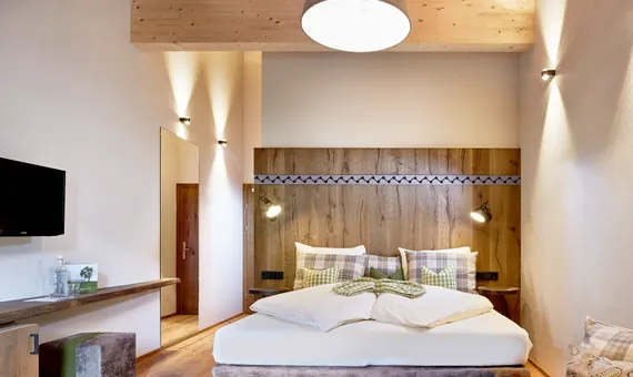 Bett im Penthouse-Zimmer die Pinzgauerin